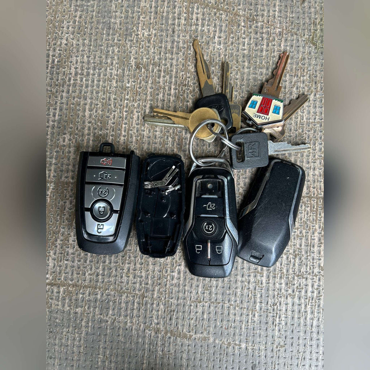 Group of refurbished Ford smart keys and remote head keys with original OEM boards
